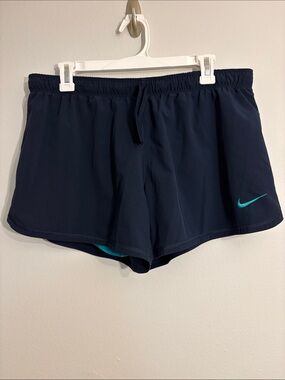 Nike Navy Athletic Shorts with Teal Swoosh size Large